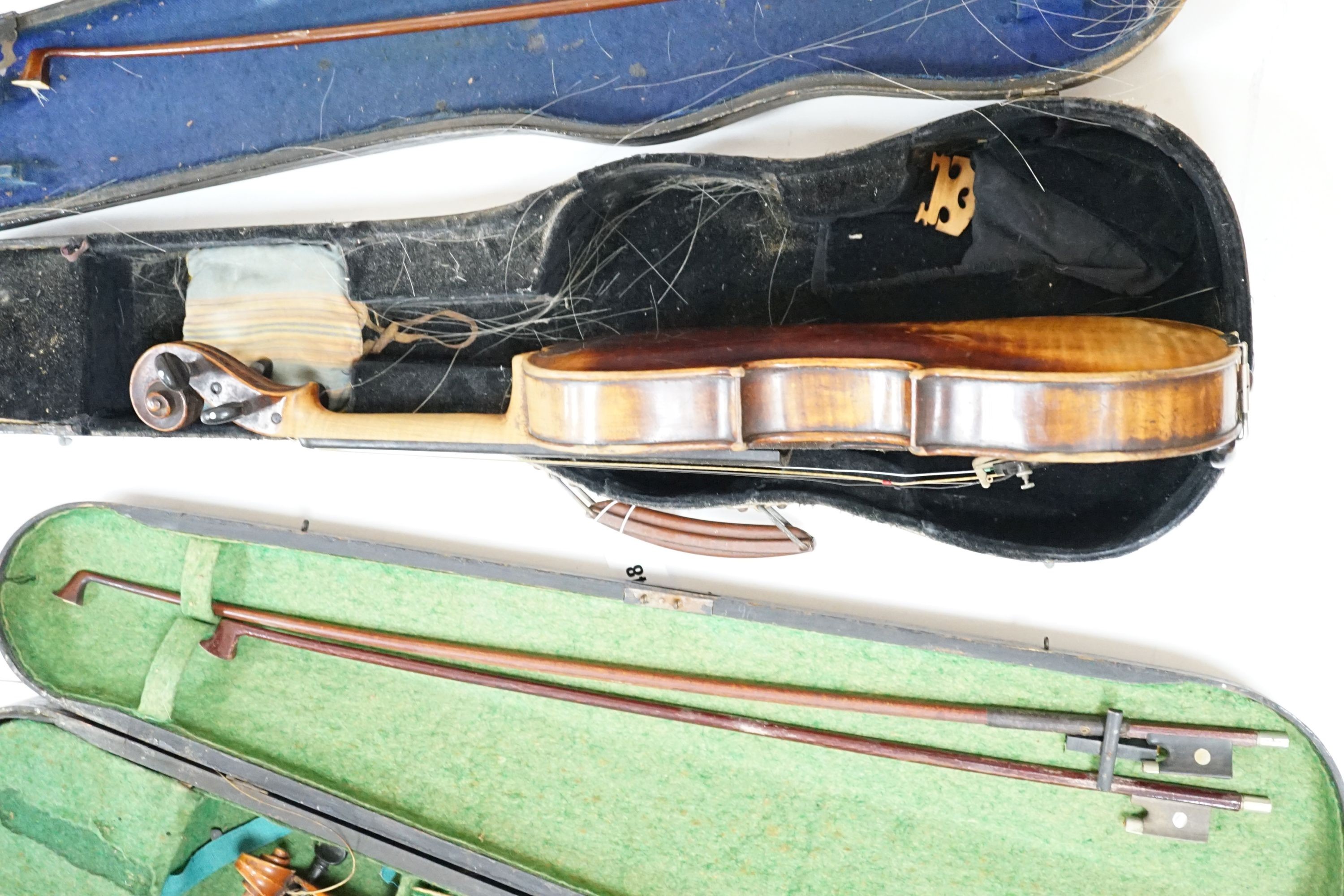 A 19th century 3/4 size violin, cased with 2 bows and 1 other German violin